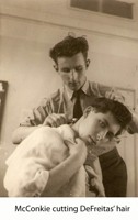 McConkie cutting DeFreitas' hair. DeFreitas was the barber but McConkie got called in for the difficult jobs!